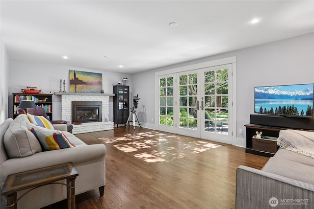 4712 90th Ave SE, Mercer Island, WA 98040 - living area with a brick fireplace, wood finished floors, recessed lighting, and french doors