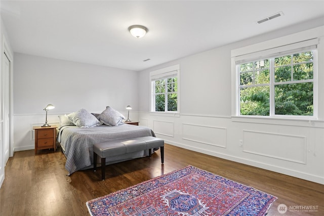 4712 90th Ave SE, Mercer Island, WA 98040 - bedroom with wood finished floors and a wainscoted wall