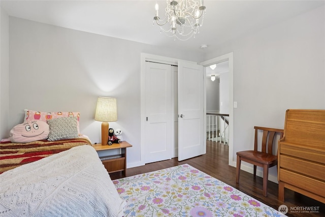 4712 90th Ave SE, Mercer Island, WA 98040 - bedroom with a chandelier, wood finished floors, and a closet