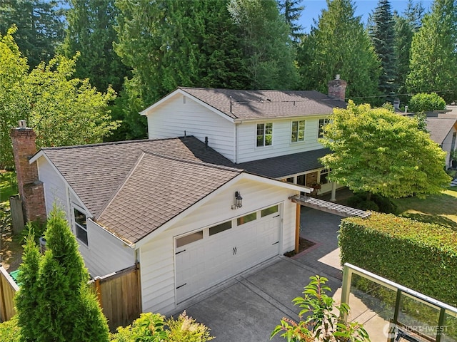 4712 90th Ave SE, Mercer Island, WA 98040 - view of front of home with a chimney, roof with shingles, an attached garage, and driveway