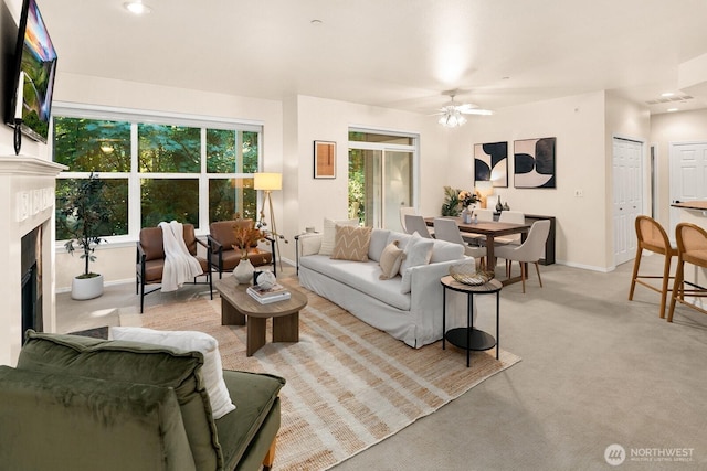 412 228th St SW Unit F101, Bothell, WA 98021 - living room featuring a ceiling fan, a fireplace, light carpet, and recessed lighting