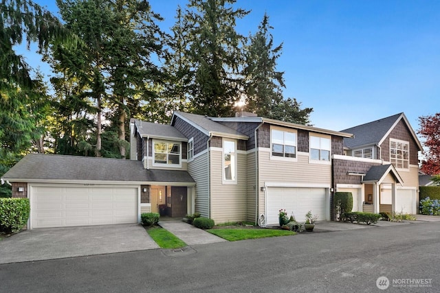412 228th St SW Unit F101, Bothell, WA 98021 - view of front of property featuring concrete driveway