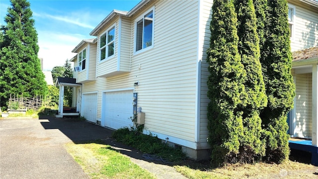 2316 Xenia St Unit 2316, Bellingham, WA 98229 - view of home's exterior featuring asphalt driveway and an attached garage