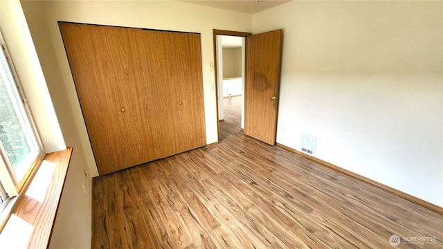 2316 Xenia St Unit 2316, Bellingham, WA 98229 - unfurnished bedroom with light wood-style floors and a closet