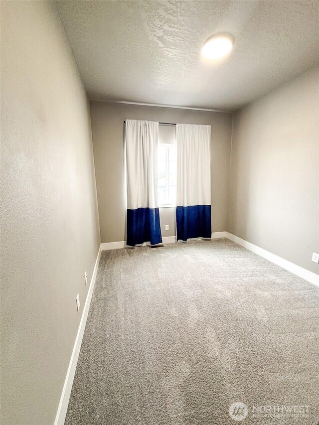 1522 E Marilyn Cir, Deer Park, WA 99006 - carpeted spare room featuring a textured ceiling