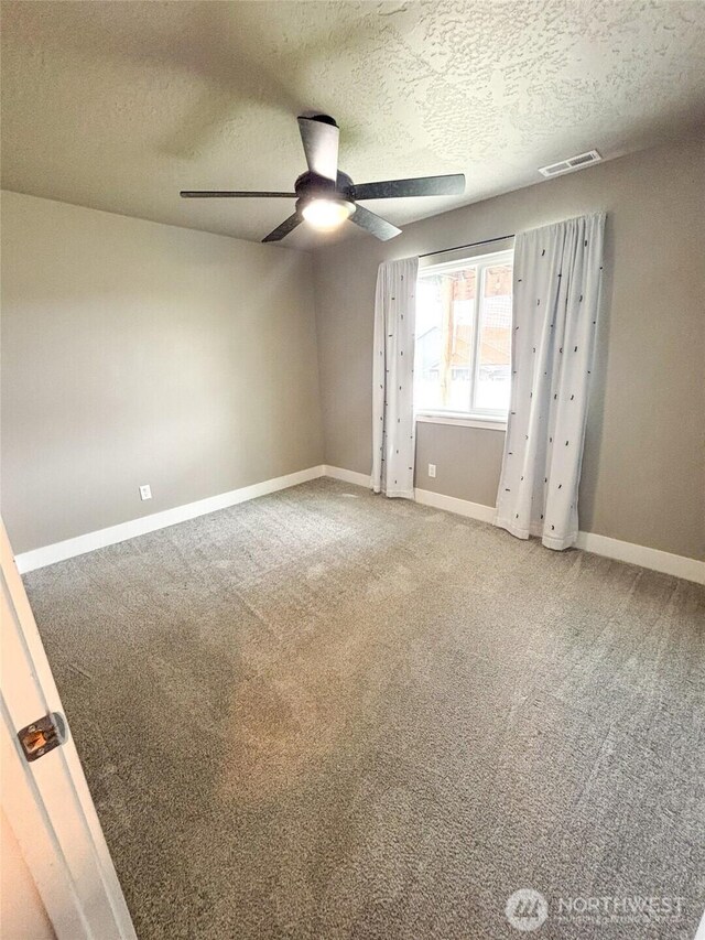 1522 E Marilyn Cir, Deer Park, WA 99006 - empty room featuring a ceiling fan, light colored carpet, and a textured ceiling