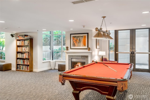 1420 Terry Ave Unit 1607, Seattle, WA 98101 - rec room with carpet floors, french doors, a warm lit fireplace, billiards, and recessed lighting
