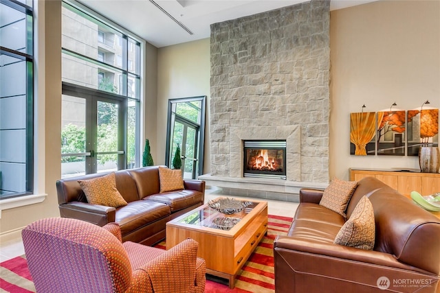 1420 Terry Ave Unit 1607, Seattle, WA 98101 - living area featuring a towering ceiling and a fireplace