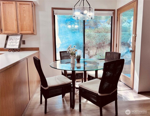 8123 129th Pl SE, Newcastle, WA 98056 - dining space featuring light wood-type flooring and a chandelier