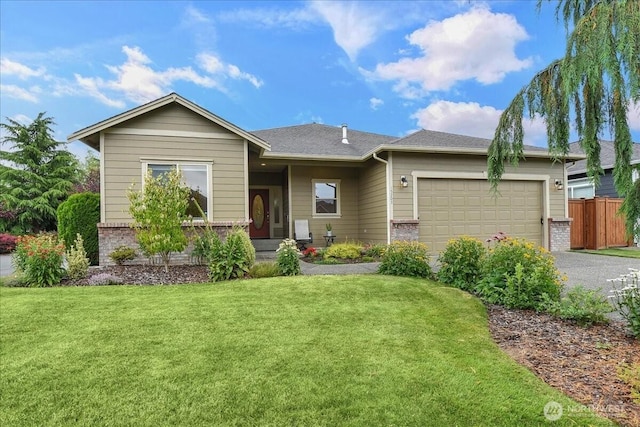 15203 148th Avenue Ct E, Orting, WA 98360 - view of front of home with brick siding, driveway, and a garage