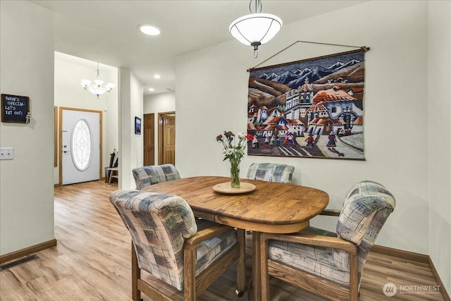 15203 148th Avenue Ct E, Orting, WA 98360 - dining space featuring light wood finished floors, a chandelier, and recessed lighting