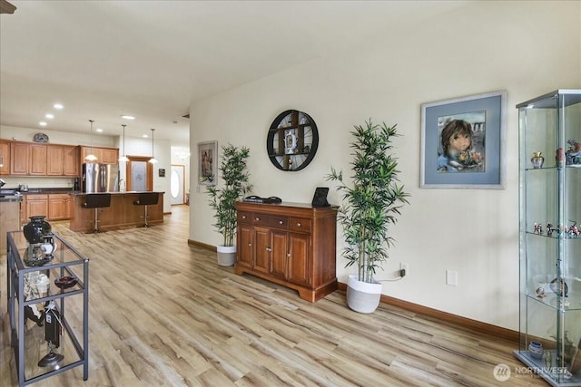 15203 148th Avenue Ct E, Orting, WA 98360 - living area featuring light wood finished floors and recessed lighting