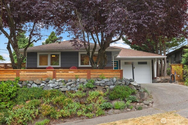 4301 1st Ave NW, Seattle, WA 98107 - view of front of home with a garage, concrete driveway, and a shingled roof