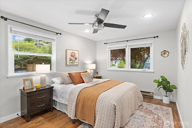 4301 1st Ave NW, Seattle, WA 98107 - bedroom with wood finished floors, a baseboard heating unit, recessed lighting, and a ceiling fan