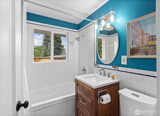 4301 1st Ave NW, Seattle, WA 98107 - bathroom with tile walls, vanity, and shower / bath combo with shower curtain