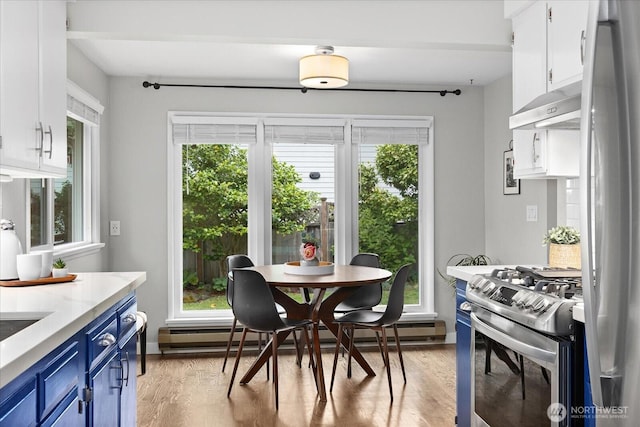 4301 1st Ave NW, Seattle, WA 98107 - dining space with light wood finished floors and a baseboard heating unit