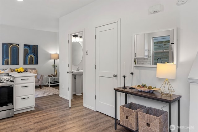 4802 Delridge Way SW, Seattle, WA 98106 - hallway featuring wood finished floors and a sink