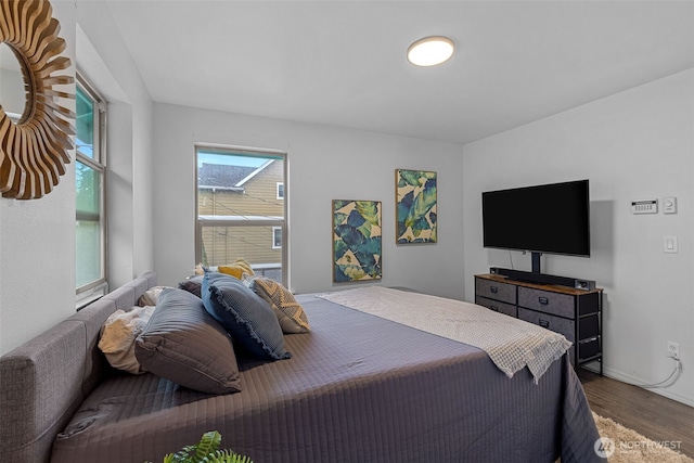 4802 Delridge Way SW, Seattle, WA 98106 - bedroom featuring dark wood-type flooring and baseboards