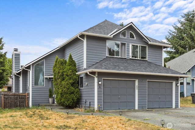 2826 NE 8th St, Renton, WA 98056 - view of front of house featuring an attached garage, roof with shingles, a chimney, and asphalt driveway