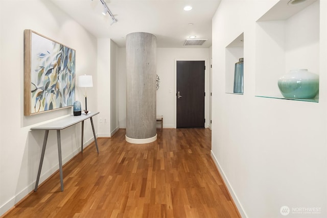 2033 2nd Ave Unit 703, Seattle, WA 98121 - hall with wood finished floors, rail lighting, and recessed lighting