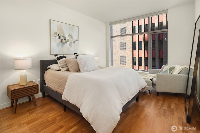 2033 2nd Ave Unit 703, Seattle, WA 98121 - bedroom featuring wood finished floors