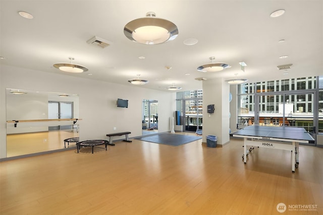 2033 2nd Ave Unit 703, Seattle, WA 98121 - game room featuring wood finished floors and baseboards