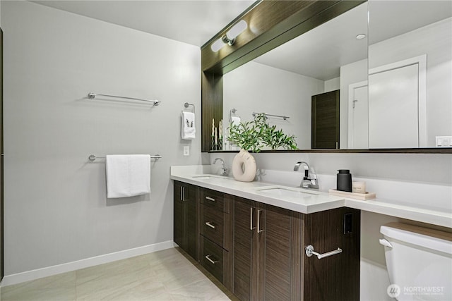 1760 NW 56th St Unit 520, Seattle, WA 98107 - full bathroom featuring double vanity and baseboards