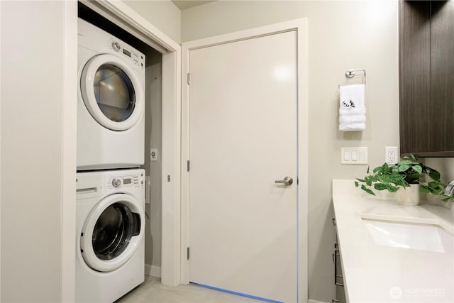 1760 NW 56th St Unit 520, Seattle, WA 98107 - laundry room featuring estacked washer and dryer