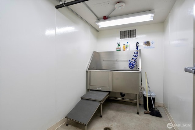 1760 NW 56th St Unit 520, Seattle, WA 98107 - misc room with pet washing area and concrete flooring
