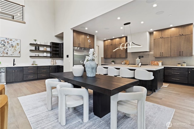 5515 108th Ave NE, Kirkland, WA 98033 - dining space featuring light wood-style flooring, recessed lighting, and beverage cooler