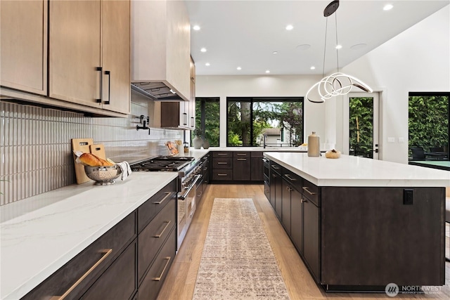 5515 108th Ave NE, Kirkland, WA 98033 - kitchen featuring custom range hood, recessed lighting, decorative backsplash, light wood-style flooring, and hanging light fixtures