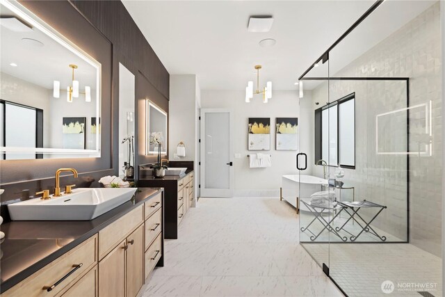 5515 108th Ave NE, Kirkland, WA 98033 - full bathroom with a chandelier, a freestanding bath, two vanities, a shower stall, and marble look tiles