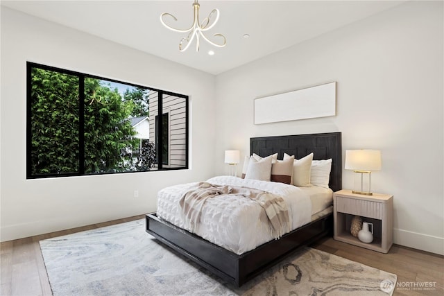 5515 108th Ave NE, Kirkland, WA 98033 - bedroom with a chandelier, wood finished floors, and recessed lighting