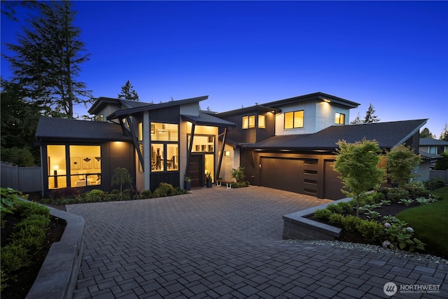 5515 108th Ave NE, Kirkland, WA 98033 - contemporary house featuring a garage, decorative driveway, and stucco siding