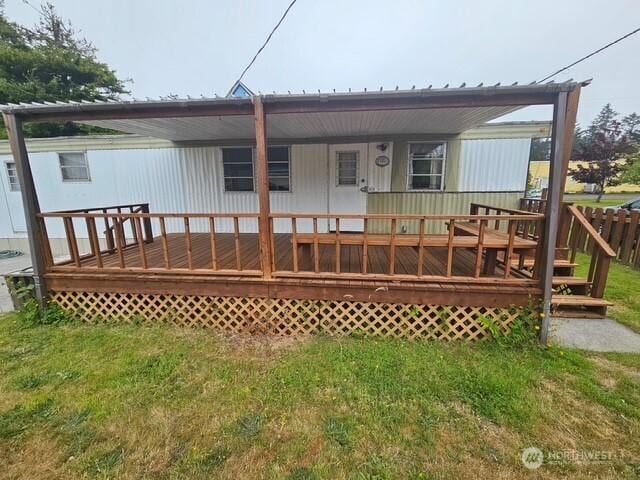 3906 L Pl, Seaview, WA 98644 - back of property with a metal roof and a yard