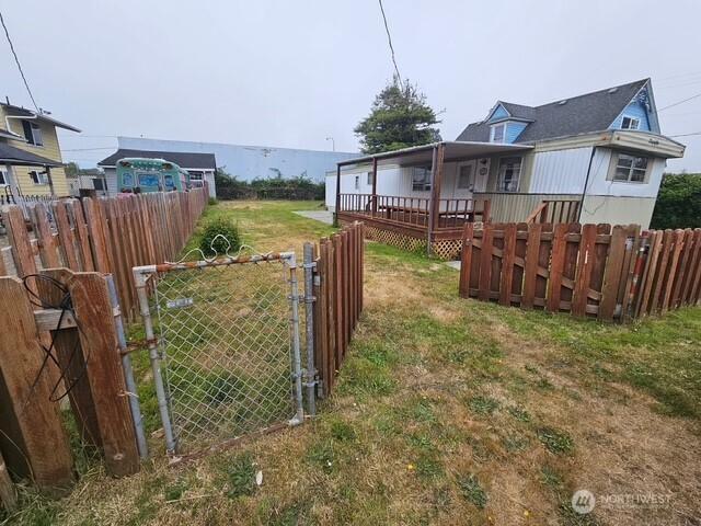 3906 L Pl, Seaview, WA 98644 - view of yard with a gate and a deck