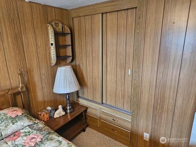 3906 L Pl, Seaview, WA 98644 - bedroom featuring wooden walls and carpet