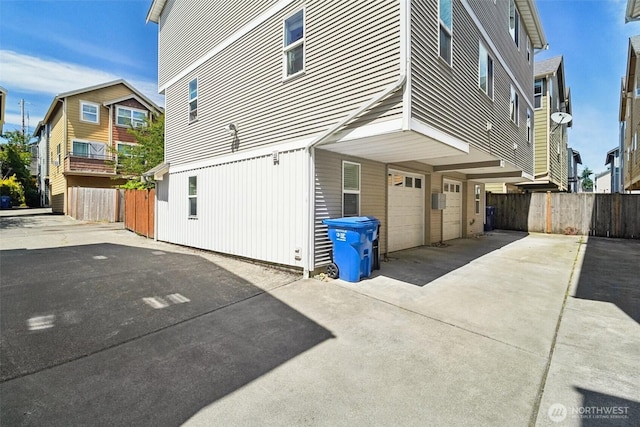 9211 Ashworth Ave N Unit B, Seattle, WA 98103 - view of property exterior with concrete driveway and a garage
