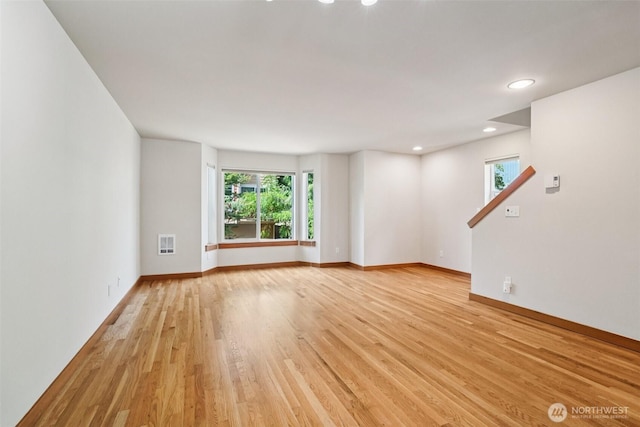 9211 Ashworth Ave N Unit B, Seattle, WA 98103 - unfurnished living room featuring light wood-style flooring and recessed lighting