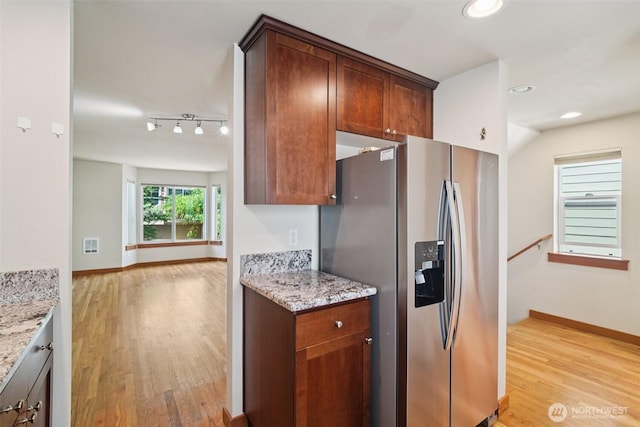 9211 Ashworth Ave N Unit B, Seattle, WA 98103 - kitchen featuring stainless steel fridge with ice dispenser, light wood-style flooring, light stone countertops, and recessed lighting