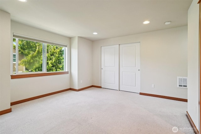 9211 Ashworth Ave N Unit B, Seattle, WA 98103 - unfurnished bedroom featuring carpet floors, recessed lighting, and a closet