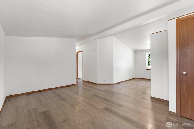 12407 Prairie Ridge Dr E, Bonney Lake, WA 98391 - spare room featuring light wood-type flooring and baseboards