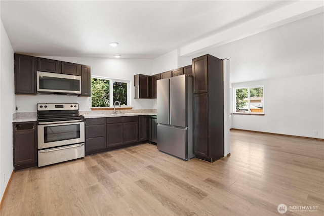 12407 Prairie Ridge Dr E, Bonney Lake, WA 98391 - kitchen featuring stainless steel appliances, plenty of natural light, light countertops, and recessed lighting