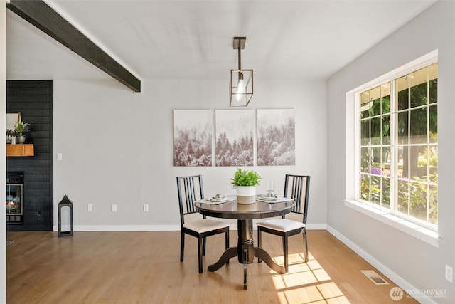 2141 Jason Ct, Ferndale, WA 98248 - dining area featuring healthy amount of natural light, wood finished floors, and a large fireplace