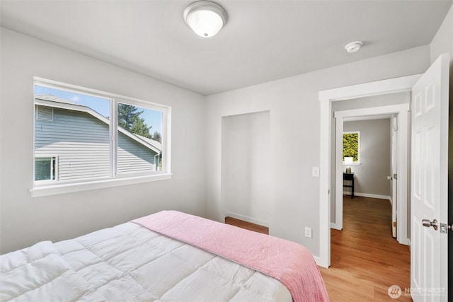 2141 Jason Ct, Ferndale, WA 98248 - bedroom with multiple windows and light wood finished floors