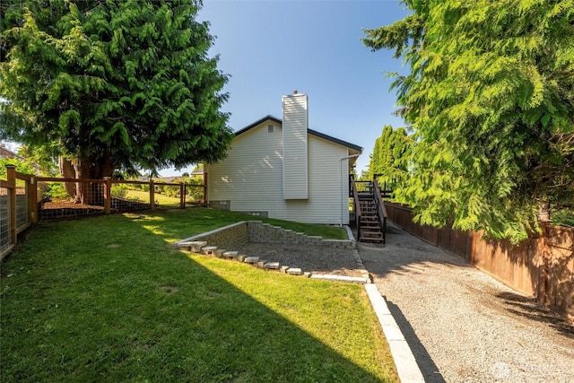 2141 Jason Ct, Ferndale, WA 98248 - fenced backyard featuring stairway and gravel driveway