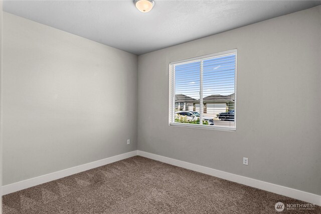 832 Q St SW, Quincy, WA 98848 - carpeted empty room featuring baseboards