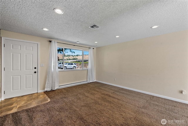 1315 Gaspar St, Wenatchee, WA 98801 - foyer featuring carpet floors, a textured ceiling, and recessed lighting