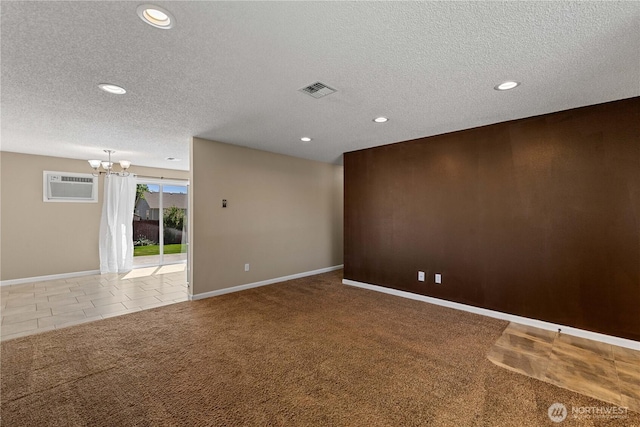 1315 Gaspar St, Wenatchee, WA 98801 - carpeted spare room with a chandelier, an AC wall unit, a textured ceiling, and recessed lighting