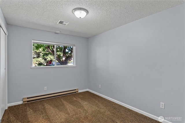 1315 Gaspar St, Wenatchee, WA 98801 - carpeted empty room featuring baseboard heating and a textured ceiling
